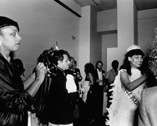 Mlle Bourgeoise Noire smiles, she smiles, she smiles. Mlle Bourgeoise Noire performance by Lorraine O'Grady.