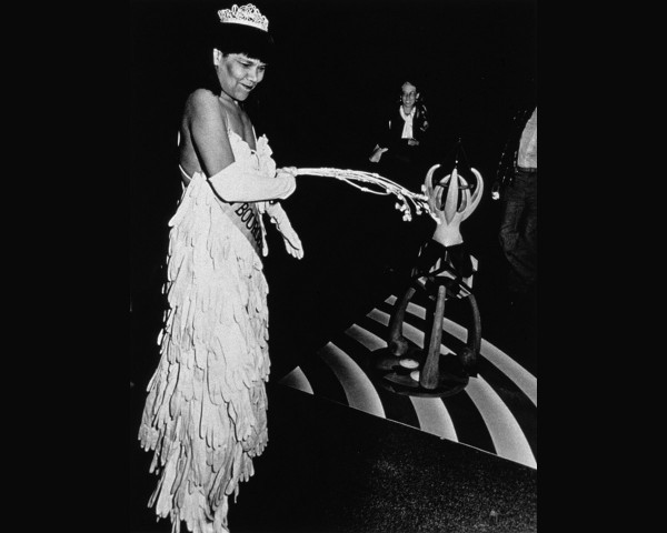 Mlle Bourgeoise Noire beats herself with the whip-that-made-plantations-move. Mlle Bourgeoise Noire performance by Lorraine O'Grady.