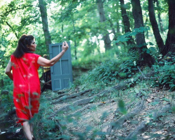 The Woman in Red walks toward the studio of the Black Artists in Yellow, performance Rivers First Draft by Lorraine O’Grady.