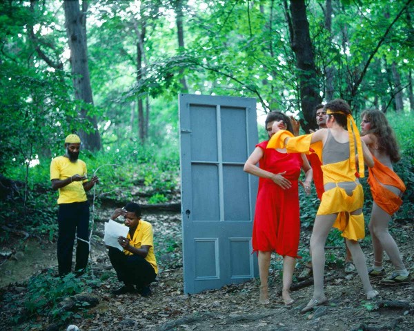 The Woman in Red begins to break away from the Debauchees, performance Rivers First Draft by Lorraine O’Grady.